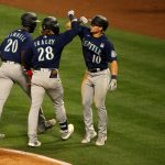ANAHEIM, CALIFORNIA - JUNE 03: Jake Fraley #28 of the Seattle Mariners celebrates with teammates after hitting a home run in the fourth inning against the Los Angeles Angels at Angel Stadium of Anaheim on June 03, 2021 in Anaheim, California. (Photo by Katharine Lotze/Getty Images)