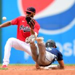 CLEVELAND, OHIO - JUNE 13: Amed Rosario #1 of the Cleveland Indians tags out Dylan Moore #25 of the Seattle Mariners at second base in the third inning during their game at Progressive Field on June 13, 2021 in Cleveland, Ohio. (Photo by Emilee Chinn/Getty Images)