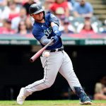 CLEVELAND, OHIO - JUNE 13: Ty France #23 of the Seattle Mariners hits a single in the third inning during their game against the Cleveland Indians at Progressive Field on June 13, 2021 in Cleveland, Ohio. (Photo by Emilee Chinn/Getty Images)