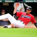 CLEVELAND, OHIO - JUNE 13: Bradley Zimmer #4 of the Cleveland Indians slides into home base past Jose Godoy #78 of the Seattle Mariners for a run in the sixth inning off of a hit by Amed Rosario #1 during their game at Progressive Field on June 13, 2021 in Cleveland, Ohio. (Photo by Emilee Chinn/Getty Images)
