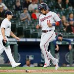 SEATTLE, WASHINGTON - JUNE 14: Jorge Polanco #11 of the Minnesota Twins scores a run during the first inning against the Seattle Mariners at T-Mobile Park on June 14, 2021 in Seattle, Washington. (Photo by Steph Chambers/Getty Images)