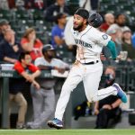 SEATTLE, WASHINGTON - JUNE 14: J.P. Crawford #3 of the Seattle Mariners scores a run against the Minnesota Twins during the third inning at T-Mobile Park on June 14, 2021 in Seattle, Washington. (Photo by Steph Chambers/Getty Images)