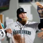 SEATTLE, WASHINGTON - JUNE 14: Jake Fraley #28 of the Seattle Mariners reacts after he scored a run against the Minnesota Twins during the fifth inning at T-Mobile Park on June 14, 2021 in Seattle, Washington. (Photo by Steph Chambers/Getty Images)