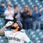 SEATTLE, WASHINGTON - JUNE 15: J.P. Crawford #3 of the Seattle Mariners reacts after his home run against the Minnesota Twins during the first inning at T-Mobile Park on June 15, 2021 in Seattle, Washington. (Photo by Steph Chambers/Getty Images)