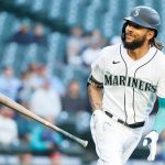 SEATTLE, WASHINGTON - JUNE 15: J.P. Crawford #3 of the Seattle Mariners tosses his bat after his home run against the Minnesota Twins during the first inning at T-Mobile Park on June 15, 2021 in Seattle, Washington. (Photo by Steph Chambers/Getty Images)