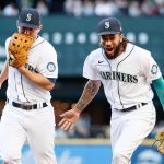 SEATTLE, WASHINGTON - JUNE 15: Kyle Seager #15 and J.P. Crawford #3 of the Seattle Mariners react after the first inning against the Minnesota Twins at T-Mobile Park on June 15, 2021 in Seattle, Washington. (Photo by Steph Chambers/Getty Images)