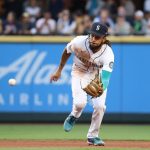 SEATTLE, WASHINGTON - JUNE 16: J.P. Crawford #3 of the Seattle Mariners fields the ball to force an out at first base during the fourth inning against the Minnesota Twins at T-Mobile Park on June 16, 2021 in Seattle, Washington. (Photo by Abbie Parr/Getty Images)