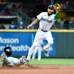 SEATTLE, WASHINGTON - JUNE 17: J.P. Crawford #3 of the Seattle Mariners makes a catch as Randy Arozarena #56 of the Tampa Bay Rays steals second base during the game at T-Mobile Park on June 17, 2021 in Seattle, Washington. (Photo by Alika Jenner/Getty Images)