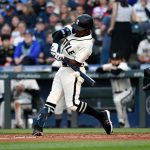 SEATTLE, WASHINGTON - JUNE 19: Shed Long Jr. #4 of the Seattle Mariners makes contact during the game against the Tampa Bay Rays at T-Mobile Park on June 19, 2021 in Seattle, Washington. (Photo by Alika Jenner/Getty Images)