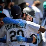 SEATTLE, WASHINGTON - JUNE 20: Luis Torrens #22 of the Seattle Mariners hugs Taylor Trammell #20 in the dugout after hiting a home run during the game against the Tampa Bay Rays  at T-Mobile Park on June 20, 2021 in Seattle, Washington. (Photo by Alika Jenner/Getty Images)