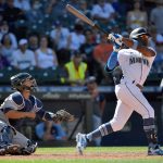 SEATTLE, WASHINGTON - JUNE 20: Shed Long Jr. #4 of the Seattle Mariners hits a game winning grand slam against the Tampa Bay Rays at T-Mobile Park on June 20, 2021 in Seattle, Washington. The Seattle Mariners beat the Tampa Bay Rays 6-2 in extra innings. (Photo by Alika Jenner/Getty Images)
