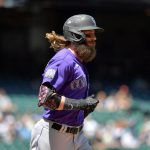 SEATTLE, WASHINGTON - JUNE 23: Charlie Blackmon #19 of the Colorado Rockies is walked to first base during the game against the Seattle Mariners at T-Mobile Park on June 23, 2021 in Seattle, Washington. (Photo by Alika Jenner/Getty Images)