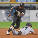 CHICAGO, ILLINOIS - JUNE 25: Dylan Moore #25 of the Seattle Mariners steals second base ahead of the throw to Tim Anderson #7 of the Chicago White Sox in the 6th inning at Guaranteed Rate Field on June 25, 2021 in Chicago, Illinois. (Photo by Jonathan Daniel/Getty Images)