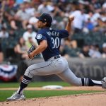 CHICAGO, ILLINOIS - JUNE 27: Robert Dugger #30 of the Seattle Mariners pitches in the first inning against the Chicago White Sox at Guaranteed Rate Field on June 27, 2021 in Chicago, Illinois. (Photo by Quinn Harris/Getty Images)