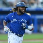 BUFFALO, NEW YORK - JUNE 29: Vladimir Guerrero Jr. #27 of the Toronto Blue Jays smiles as he runs to first after hitting a single during the fourth inning against the Seattle Mariners at Sahlen Field on June 29, 2021 in Buffalo, New York. (Photo by Joshua Bessex/Getty Images)