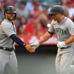 ANAHEIM, CA - JULY 16: Kyle Seager #15 is greeted by Ty France #23 of the Seattle Mariners after hitting a two-run home run in the third inning of the game against the Los Angeles Angels at Angel Stadium of Anaheim on July 16, 2021 in Anaheim, California. (Photo by Jayne Kamin-Oncea/Getty Images)