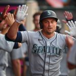ANAHEIM, CA - JULY 16: Kyle Seager #15 of the Seattle Mariners is greeted in the dugout after hitting a two-run home run in the third inning of the game against the Los Angeles Angels at Angel Stadium of Anaheim on July 16, 2021 in Anaheim, California. (Photo by Jayne Kamin-Oncea/Getty Images)