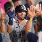 ANAHEIM, CA - JULY 16: Mitch Haniger #17 of the Seattle Mariners celebrates in the dugout after hitting a two-run home run in the seventh inning of the game against the Los Angeles Angels at Angel Stadium of Anaheim on July 16, 2021 in Anaheim, California. (Photo by Jayne Kamin-Oncea/Getty Images)