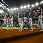 ARLINGTON, TX - JULY 30: The Seattle Mariners walk into the dugout before the first inning of a baseball game against the Texas Rangers at Globe Life Field on July 30, 2021 in Arlington, Texas. (Photo by Andy Jacobsohn/Getty Images)