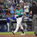 SEATTLE, WASHINGTON - JULY 02: Jake Fraley #28 of the Seattle Mariners steps on home plate after hitting a home run during the fifth inning the game against the Texas Rangers at T-Mobile Park on July 02, 2021 in Seattle, Washington. (Photo by Alika Jenner/Getty Images)