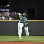 SEATTLE, WASHINGTON - JULY 02: Shed Long Jr. #4 of the Seattle Mariners makes a throw during the fifth inning game against the Texas Rangers at T-Mobile Park on July 02, 2021 in Seattle, Washington. (Photo by Alika Jenner/Getty Images)