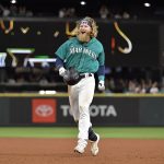 SEATTLE, WASHINGTON - JULY 02: Jake Fraley #28 of the Seattle Mariners celebrates after hitting a single to win the game in the 10th inning against the Texas Rangers at T-Mobile Park on July 02, 2021 in Seattle, Washington. The Mariners beat the Rangers 5-4 in 10 innings. (Photo by Alika Jenner/Getty Images)