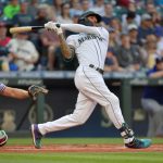 SEATTLE, WASHINGTON - JULY 03: J.P. Crawford #3 of the Seattle Mariners makes contact during the first inning of the game against the Texas Rangers at T-Mobile Park on July 03, 2021 in Seattle, Washington. (Photo by Alika Jenner/Getty Images)