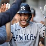 SEATTLE, WASHINGTON - JULY 06: Giancarlo Stanton #27 of the New York Yankees celebrates with teammates after a first inning three-run home run against the Seattle Mariners at T-Mobile Park on July 06, 2021 in Seattle, Washington. (Photo by Alika Jenner/Getty Images)