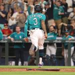 SEATTLE, WASHINGTON - JULY 09: J.P. Crawford #3 scores off an RBI single by Ty France #23 of the Seattle Mariners to tie the game 3-3 during the seventh inning against the Los Angeles Angels at T-Mobile Park on July 09, 2021 in Seattle, Washington. (Photo by Abbie Parr/Getty Images)