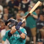 SEATTLE, WASHINGTON - JULY 09: Mitch Haniger #17 of the Seattle Mariners hits a grand slam to take a 7-3 lead against the Los Angeles Angels during the eighth inning at T-Mobile Park on July 09, 2021 in Seattle, Washington. (Photo by Abbie Parr/Getty Images)