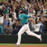 SEATTLE, WASHINGTON - JULY 09: Mitch Haniger #17 of the Seattle Mariners laps the bases after hitting a grand slam to take a 7-3 lead against the Los Angeles Angels during the eighth inning at T-Mobile Park on July 09, 2021 in Seattle, Washington. (Photo by Abbie Parr/Getty Images)