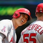SEATTLE, WASHINGTON - JULY 11: Shohei Ohtani #17 reacts with third base coach Brian Butterfield #55 of the Los Angeles Angels during the first inning against the Seattle Mariners at T-Mobile Park on July 11, 2021 in Seattle, Washington. (Photo by Steph Chambers/Getty Images)