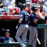 ANAHEIM, CALIFORNIA - JULY 18: Mitch Haniger #17, Tom Murphy #2, and Ty France #23 of the Seattle Mariners celebrate scoring off an error during the first inning against the Los Angeles Angels at Angel Stadium of Anaheim on July 18, 2021 in Anaheim, California. (Photo by Katelyn Mulcahy/Getty Images)