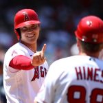 ANAHEIM, CALIFORNIA - JULY 18: Shohei Ohtani #17 of the Los Angeles Angels reacts to first base coach Bruce Hines #99 during the third inning against the Seattle Mariners at Angel Stadium of Anaheim on July 18, 2021 in Anaheim, California. (Photo by Katelyn Mulcahy/Getty Images)