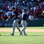 ANAHEIM, CALIFORNIA - JULY 18: Kyle Seager #15, Mitch Haniger #17, Ty France #23 and Dillon Thomas #27 of the Seattle Mariners celebrate their 7-4 win against the Los Angeles Angels after the game at Angel Stadium of Anaheim on July 18, 2021 in Anaheim, California. (Photo by Katelyn Mulcahy/Getty Images)