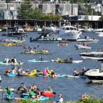 SEATTLE, WASHINGTON - JULY 21: Fans float nearby the 2021 NHL Expansion Draft at Gas Works Park on July 21, 2021 in Seattle, Washington. The Seattle Kraken is the National Hockey League's newest franchise and will begin play in October 2021. (Photo by Alika Jenner/Getty Images)