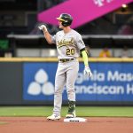 SEATTLE, WASHINGTON - JULY 22: Mark Canha #20 of the Oakland Athletics gestures after hitting a double during the first inning of the game against the Seattle Mariners at T-Mobile Park on July 22, 2021 in Seattle, Washington. (Photo by Alika Jenner/Getty Images)