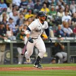SEATTLE, WASHINGTON - JULY 24: Ty France #23 of the Seattle Mariners hits a single to right during the first inning against the Oakland Athletics at T-Mobile Park on July 24, 2021 in Seattle, Washington. (Photo by Alika Jenner/Getty Images)