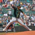 SEATTLE, WASHINGTON - JULY 25: Cole Irvin #19 of the Oakland Athletics throws a pitch during the first inning against the Seattle Mariners at T-Mobile Park on July 25, 2021 in Seattle, Washington. (Photo by Alika Jenner/Getty Images)
