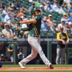 SEATTLE, WASHINGTON - JULY 25: Matt Olson #28 of the Oakland Athletics hits a single during the first inning of the game against the Seattle Mariners at T-Mobile Park on July 25, 2021 in Seattle, Washington. (Photo by Alika Jenner/Getty Images)