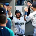 SEATTLE, WASHINGTON - JULY 26: Ty France #23 of the Seattle Mariners celebrates with teammates after Cal Raleigh's three run scoring double in the fourth inning of the game against the Houston Astros at T-Mobile Park on July 26, 2021 in Seattle, Washington. (Photo by Alika Jenner/Getty Images)