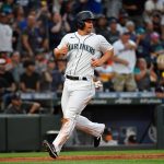 SEATTLE, WASHINGTON - JULY 26: Kyle Seager #15 of the Seattle Mariners scores on Cal Raleigh's three run double in the fourth inning of the game against the Houston Astros at T-Mobile Park on July 26, 2021 in Seattle, Washington. (Photo by Alika Jenner/Getty Images)