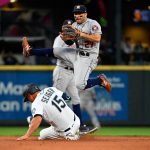 SEATTLE, WASHINGTON - JULY 26: Jose Altuve #27 of the Houston Astros leaps over Kyle Seager #15 of the Seattle Mariners, but misses the tag at second base in the fourth inning at T-Mobile Park on July 26, 2021 in Seattle, Washington. (Photo by Alika Jenner/Getty Images)