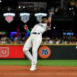 SEATTLE, WASHINGTON - JULY 26: Shed Long Jr. #4 of the Seattle Mariners catches a pop fly out to end the sixth inning of the game against the Houston Astros at T-Mobile Park on July 26, 2021 in Seattle, Washington. (Photo by Alika Jenner/Getty Images)