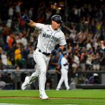 SEATTLE, WASHINGTON - JULY 26: Dylan Moore #25 of the Seattle Mariners gestures after hitting a grand slam home run in the eighth inning of the game against the Houston Astros at T-Mobile Park on July 26, 2021 in Seattle, Washington. (Photo by Alika Jenner/Getty Images)