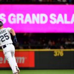 SEATTLE, WASHINGTON - JULY 26: Dylan Moore #25 of the Seattle Mariners rounds the bases after hitting a grand slam home run in the eighth inning of the game against the Houston Astros at T-Mobile Park on July 26, 2021 in Seattle, Washington. (Photo by Alika Jenner/Getty Images)