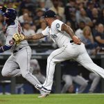 SEATTLE, WASHINGTON - JULY 27: Hector Santiago #57 of the Seattle Mariners tags out Yuli Gurriel #10 of the Houston Astros running home on a ground ball fielder's choice in the sixth inning at T-Mobile Park on July 27, 2021 in Seattle, Washington. (Photo by Alika Jenner/Getty Images)