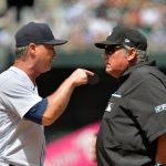 SEATTLE, WASHINGTON - JULY 28:  Manager Scott Servais #9 of the Seattle Mariners argues with umpire Adam Beck #102 after being ejected from the game in the fourth inning against the Houston Astros at T-Mobile Park on July 28, 2021 in Seattle, Washington. (Photo by Alika Jenner/Getty Images)