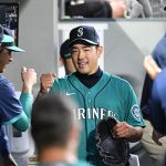 SEATTLE, WASHINGTON - JULY 23: Yusei Kikuchi #18 of the Seattle Mariners is congratulated by teammates in the sixth inning of the game against the Oakland Athletics at T-Mobile Park on July 23, 2021 in Seattle, Washington. (Photo by Alika Jenner/Getty Images)