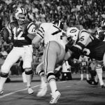 
              FILE- In this Sept. 2, 1973, file photo, New York Jets' Joe Namath (12) gets set to pass as New Orleans Saints Billy Newsome (78) puts on the pressure and Jets' Winston Hill (75) blocks. Hill was posthumously selected last year for the centennial class of the Pro Football Hall of Fame after a 15-year career. (AP Photo, File)
            